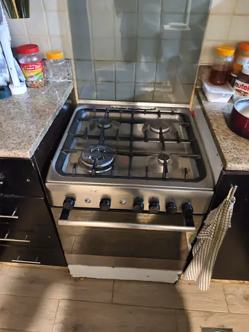 Used freestanding stainless steel gas cooker with oven (4-burner)