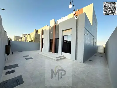 Luxury villa for sale, two floors + roof, with a modern design and spacious areas, with a large yard and patio, located near Sheikh Mohammed Bin Zayed