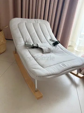 Wooden-frame baby rocker/bouncer with padded seat — light grey, good condition