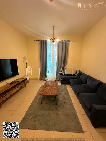 For sale: 2 bed hall apartment in City Tower Ajman, Al Nuaimiya 3, prime location, private parking, size 1199 sq ft, perfect family layout, good ROI