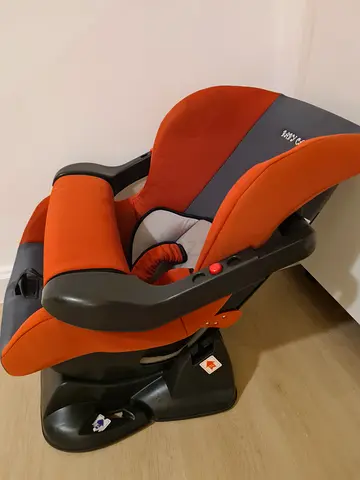 Used orange infant car seat with base - good condition