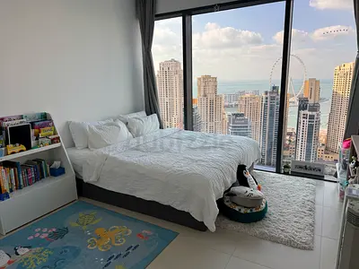 Ikea King bed with white linens + rugs in high-floor and play rug