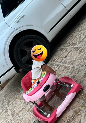 Used juniors pink baby walker in good condition