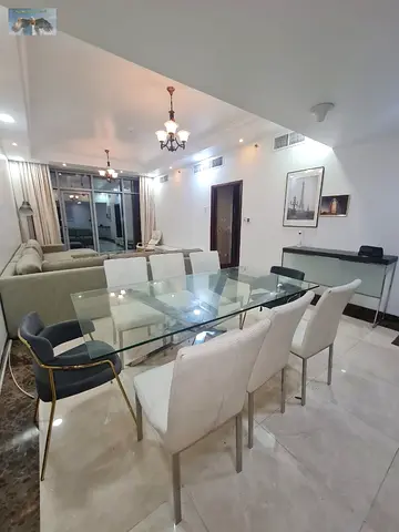 A semi-furnished, super deluxe duplex apartment is available for monthly rent in Ajman Corniche Residence. It features three bedrooms, a living room,