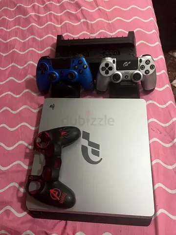 Sony PlayStation 4 Slim with 2 Controllers (blue controller is not Sony) and charging stand