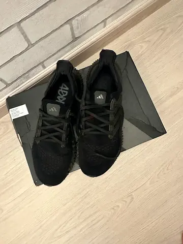 Black Adidas running shoes - size not specified, gently used