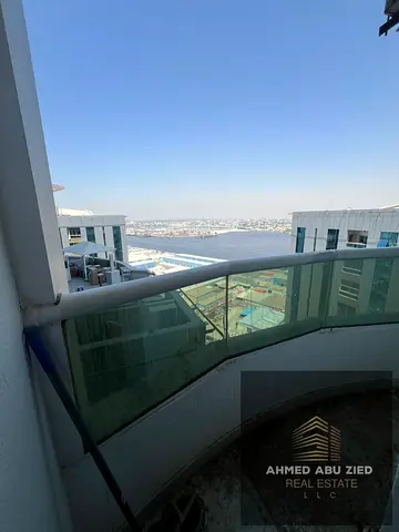 2BHK for annual rent in Orient Towers Liwara Ajman panoramic sea view luxury finishing first tenant balcony free parking 50k yearly 4 cheques only