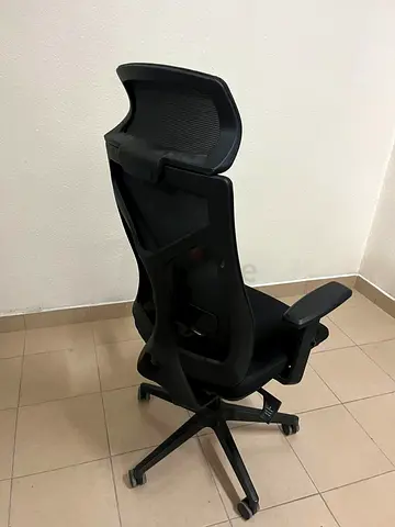 Comfortable office chair with a mesh back and sturdy nylon base