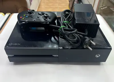 Xbox One console with controller and power brick - used