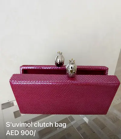 Magenta Suivimol Textured Clutch Bag
