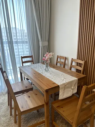 IKEA solid wood dining table with 6 chairs, excellent condition, includes table runner and decorativ