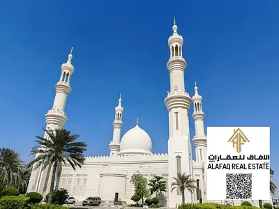 بناية استثمارية للبيع في العالية عجمان مؤجرة بالكامل تضم 22 شقة و10 محلات بموقع زاوية على شارع رئيسي حيوي مميز