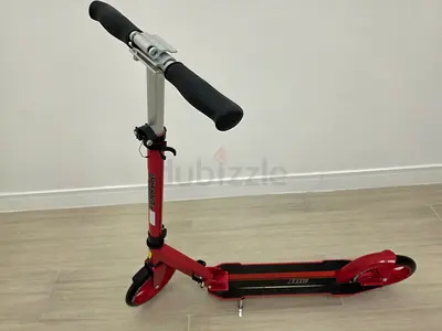 Red foldable kick scooter with adjustable handlebar - good condition