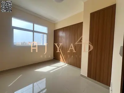 2BR apartment for annual rent in Al Jurf 3. New building, first tenant, 3 baths, balcony, central A