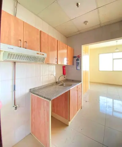 spacious Studio Available with SEPARATE KITCHEN, Wardrobes in just 30k Close to Dubai Border for more details call Mr. Hassan
