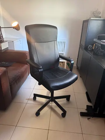 Black leather swivel office chair with armrests