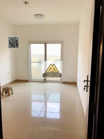 2-bedroom apartment with separate living room with door in Al Jurf 2, Ajman. 2 master bedrooms, balcony, large space, family building near the univers
