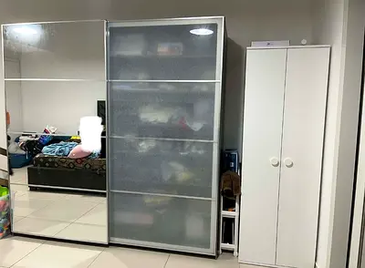 White sliding wardrobe with mirrored door — good condition