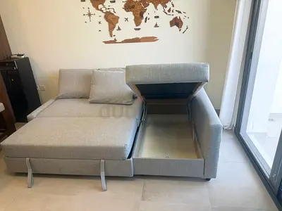 Ikea Light grey fabric L-shaped sofa with storage chaise