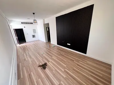 Two-bedroom apartment with a living room and rooftop terrace for rent in Al Jurf 3, Ajman – very spacious, 2 bathrooms, central air conditioning,