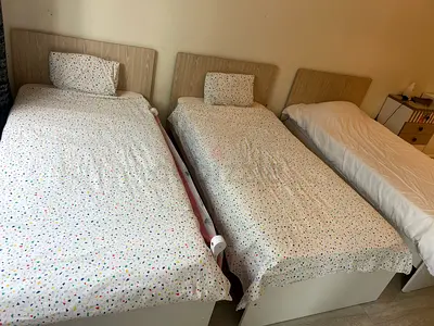 Three single beds with mattresses and headboards - good condition