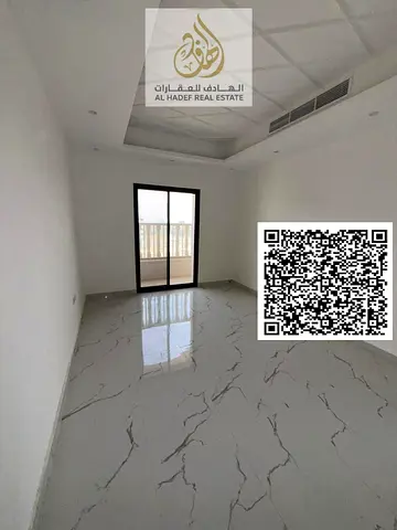 For rent in Al Alia, Ajman, first occupancy, two bedrooms, living room, three bathrooms, and balcon