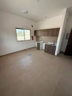 Modern studio for rent, first tenant, in Al Rashidiya 3. Unfurnished, in a prime location close to a