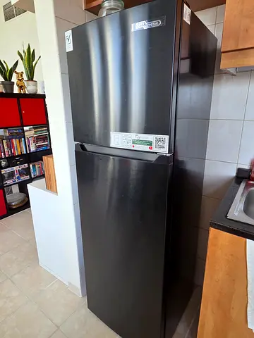 Black top-freezer refrigerator - good working condition