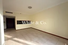 Vacant | Balcony, Unfurnished | Low Floor