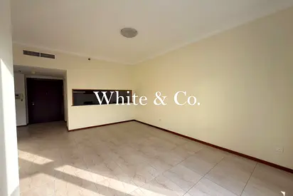 Vacant | Balcony, Unfurnished | Low Floor