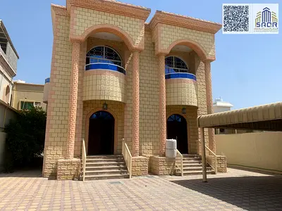 A luxurious modern-designed villa featuring four spacious bedrooms, two comfortable living rooms, and an elegant majlis for hosting guests. The prope