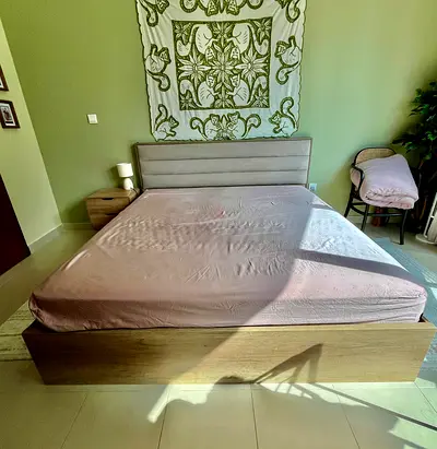 King-size bed frame with headboard and bedside table