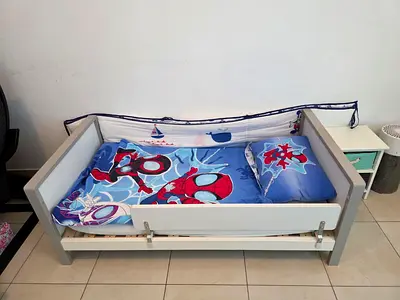 Toddler Bed set that has the parts to become a cot. with Spiderman Bedding — accompanying closet.
