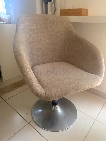 Beige rotating office chair