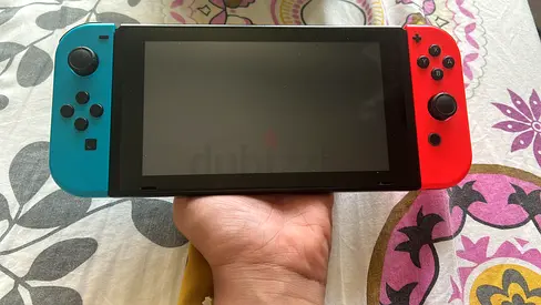 Nintendo Switch Console (Neon Blue/Red) - Good Working Condition with a game
