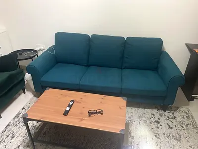Teal three-seater fabric sofa - good condition