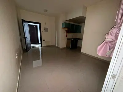 Studio apartment for rent in Al Hamidiya, Ajman - balcony, semi-separate kitchen, central air conditioning, suitable for families, prime location.