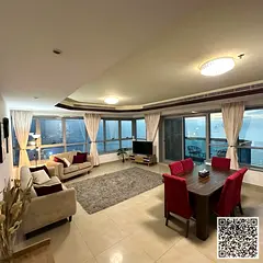 Furnished apartment for rent in Ajman Corniche - two bedrooms, a hall, a gym, a swimming pool, and p