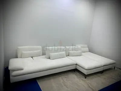 Selling rochebobois white color lshape sofa