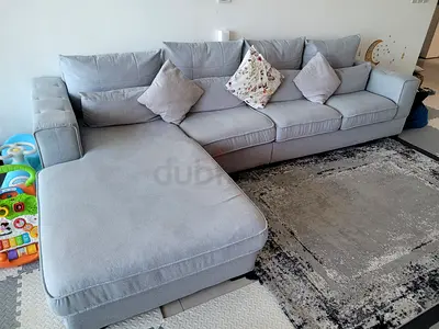 Light grey L-shaped fabric sofa with chaise - good condition