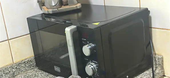 Black countertop microwave oven - good working condition need repair ,for free
