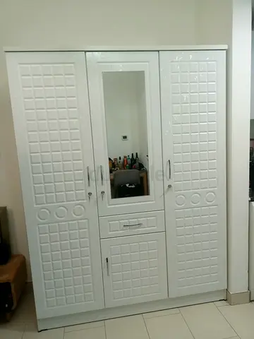Hi I am sale 3 door cabinet brand new available
