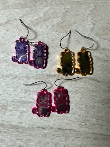 3 pieces of cat themed earrings in different colors