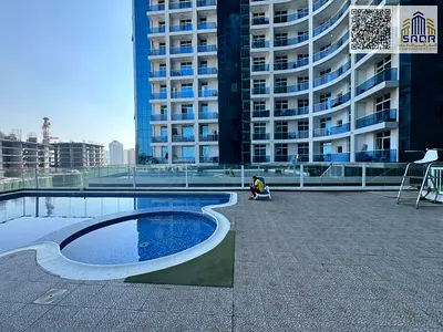 For sale: One bedroom and living room in Al Waha Towers, Ajman, with gym, swimming pool, and parking.