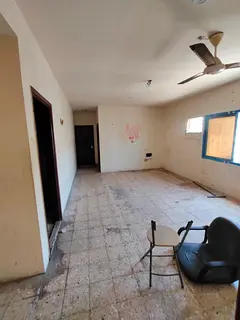 2 Bedrooms Hall for rent in Al Butina with an official singles contract for AED 36,000 yearly