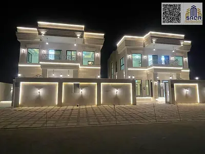 Villa for sale in Ajman, Al Helio 2 area. The villa features 4 master bedrooms, a majlis (formal sitting room), 2 living rooms, a fully equipped kitch
