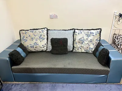 Compact three  two-seater sofa in blue faux leather with cushions washable cover.