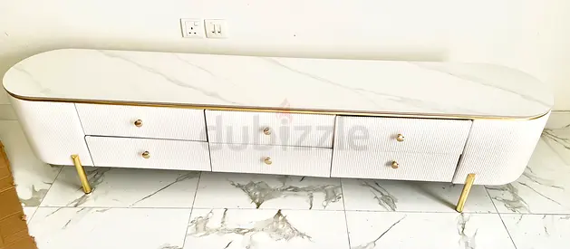 Long white marble-top TV console/sideboard with gold legs and six drawers