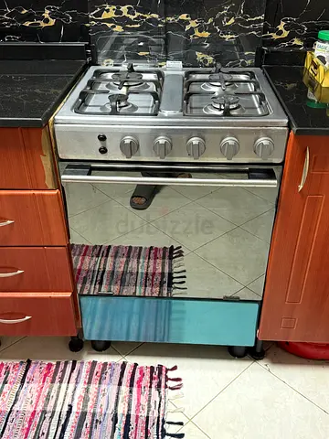 Used freestanding gas stove with oven - stainless steel, 4 burners