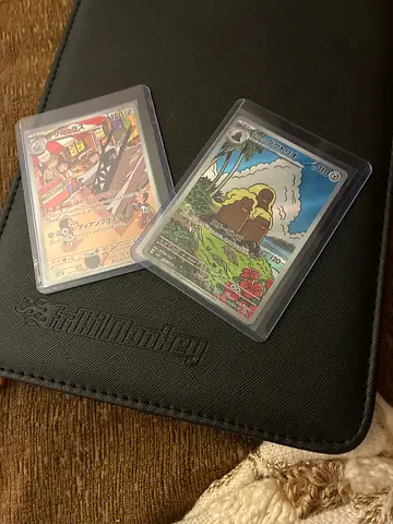 Two Vintage Collectible Trading Cards in Protective Sleeves